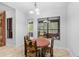 Cozy breakfast nook featuring a door to the porch and backyard views through a picture window at 549 Wellon Ave, Orlando, FL 32833