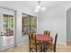 Cozy breakfast nook featuring a door to the porch and backyard views through a picture window at 549 Wellon Ave, Orlando, FL 32833