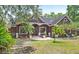 Charming home exterior featuring a well-maintained lawn and mature trees at 549 Wellon Ave, Orlando, FL 32833