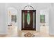 Elegant foyer boasting tile floors, decorative tile accent, a beautiful front door and bright natural light at 549 Wellon Ave, Orlando, FL 32833