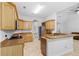 This kitchen boasts tile floors, wooden cabinets, stainless appliances, and a breakfast bar at 549 Wellon Ave, Orlando, FL 32833
