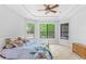 Spacious main bedroom features a tray ceiling and multiple windows that bring in natural light at 549 Wellon Ave, Orlando, FL 32833