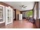 Enclosed patio with tile flooring, windows, a ceiling fan and outdoor seating at 549 Wellon Ave, Orlando, FL 32833