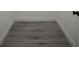 Detailed image of gray wood flooring and white wall inside a closet at 6054 Sw 154Th Place Rd, Ocala, FL 34473