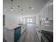 Bright kitchen with a large island, quartz countertops, stainless appliances, and sleek, modern finishes at 6054 Sw 154Th Place Rd, Ocala, FL 34473