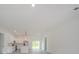 Spacious living room featuring an open floor plan and lots of natural light from sliding glass doors at 6054 Sw 154Th Place Rd, Ocala, FL 34473