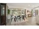Bright dining area next to screened in porch and modern refrigerator, perfect for entertaining and everyday living at 620 Fruitwood Ave, Winter Springs, FL 32708