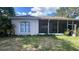 Enclosed patio and backyard, ideal for relaxation and outdoor activities at 6438 Bristol Oaks Dr, Lakeland, FL 33811