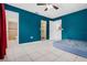 Bright bedroom with en-suite bathroom, walk-in closet, and ceiling fan at 715 Wedge Ln, Poinciana, FL 34759