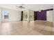 Bright and airy living room boasts tiled floors and access to a screened lanai at 715 Wedge Ln, Poinciana, FL 34759