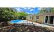 Private backyard with in-ground pool, patio space, and lush landscaping at 7600 Skyview Dr, Orlando, FL 32809