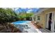 Inviting backyard features a private in-ground pool with a patio area at 7600 Skyview Dr, Orlando, FL 32809