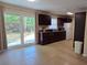 Eat-in kitchen with modern cabinets, white appliances, and backyard view at 7600 Skyview Dr, Orlando, FL 32809