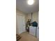 Laundry room with a washer, dryer, and water heater at 7600 Skyview Dr, Orlando, FL 32809