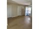 Large room with tile flooring, two closets, and a glass door to the backyard at 7600 Skyview Dr, Orlando, FL 32809