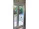 View through sliding glass doors of backyard in-ground pool and patio area at 7600 Skyview Dr, Orlando, FL 32809