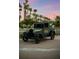 Charming vintage Ford's Garage truck displayed with palm trees under a beautiful sunset sky at 8045 Lost Shaker Ln, Kissimmee, FL 34747