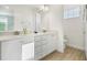 Bathroom featuring double sinks, quartz countertops, and tile floors offering both style and functionality at 8045 Lost Shaker Ln, Kissimmee, FL 34747