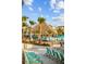 Tropical beach bar with thatched roof, lounge chairs, and sandy area at 8045 Lost Shaker Ln, Kissimmee, FL 34747