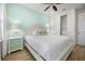 Bedroom with modern decor, light blue accent wall, walk-in closet and a ceiling fan at 8045 Lost Shaker Ln, Kissimmee, FL 34747