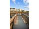 Scenic view from the community dock looking out at the colorful two-story vacation homes at 8045 Lost Shaker Ln, Kissimmee, FL 34747