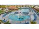 Aerial view of the community pool, splash pad, and outdoor lounging areas at 8045 Lost Shaker Ln, Kissimmee, FL 34747
