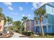 Colorful exterior showcasing unique architecture, lush landscaping, and inviting pathways, creating a vibrant and welcoming community atmosphere at 8045 Lost Shaker Ln, Kissimmee, FL 34747