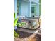 Hot tub offers a luxurious space for relaxation and entertainment on a patio enhanced by a privacy landscaping at 8045 Lost Shaker Ln, Kissimmee, FL 34747