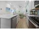 Open floor plan showcasing the kitchen with stainless steel appliances and a spacious dining area at 8045 Lost Shaker Ln, Kissimmee, FL 34747