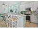 Spacious kitchen with quartz countertops, stainless steel appliances, breakfast bar and an open floorplan at 8045 Lost Shaker Ln, Kissimmee, FL 34747
