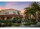 Ford's Garage with outdoor seating and classic truck, surrounded by lush tropical landscaping at 8045 Lost Shaker Ln, Kissimmee, FL 34747