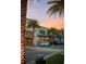 Inviting street view with retail stores, palm trees, and modern storefronts, showcasing the vibrant atmosphere at 8045 Lost Shaker Ln, Kissimmee, FL 34747