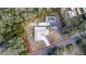 Aerial view of home highlighting property lines, pool, and surrounding trees at 817 Helen Ave, Deland, FL 32720
