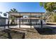 An exterior view of the back of the house featuring a large covered patio with natural light and privacy at 817 Helen Ave, Deland, FL 32720