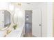 Modern bathroom features double vanity with sleek fixtures and lighting at 817 Helen Ave, Deland, FL 32720