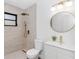 Stylishly updated bathroom with modern fixtures, including a walk-in shower and a sleek vanity sink at 817 Helen Ave, Deland, FL 32720