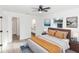 Bedroom with neutral color scheme, ceiling fan and ensuite bathroom at 817 Helen Ave, Deland, FL 32720
