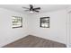 Bright bedroom with updated flooring, neutral walls, and a modern ceiling fan at 817 Helen Ave, Deland, FL 32720