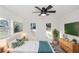 Bright bedroom with modern decor, ceiling fan and natural light at 817 Helen Ave, Deland, FL 32720