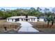 Beautiful house with a well-maintained lawn and fence surrounding the property at 817 Helen Ave, Deland, FL 32720