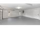 A clean, spacious garage with a neutral color scheme, natural light, and plenty of room for parking and storage at 817 Helen Ave, Deland, FL 32720