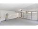 Spacious garage featuring a modern door, a water heater, and ample room for storage and vehicles at 817 Helen Ave, Deland, FL 32720