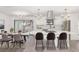 Open-concept kitchen with white cabinets, large island, and modern pendant lighting at 817 Helen Ave, Deland, FL 32720