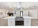 Spacious kitchen island with cooktop and white cabinetry at 817 Helen Ave, Deland, FL 32720