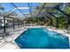 Screened-in pool with a built-in spa and ample space for relaxation at 817 Helen Ave, Deland, FL 32720