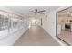 Spacious sunroom with plenty of natural light and smooth floors leading to the kitchen and other areas at 817 Helen Ave, Deland, FL 32720