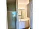 Bathroom featuring shower, sink, vanity and wood look flooring at 860 N Orange Ave # 371, Orlando, FL 32801