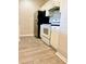 The kitchen features stainless steel refrigerator, white cabinetry and oven at 860 N Orange Ave # 371, Orlando, FL 32801