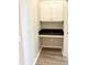 This room features a built-in desk, cabinets, and wood-look flooring at 860 N Orange Ave # 371, Orlando, FL 32801