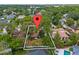 Aerial view of the home nestled among mature trees with a large, fenced backyard at 913 Moss Ln, Winter Park, FL 32789